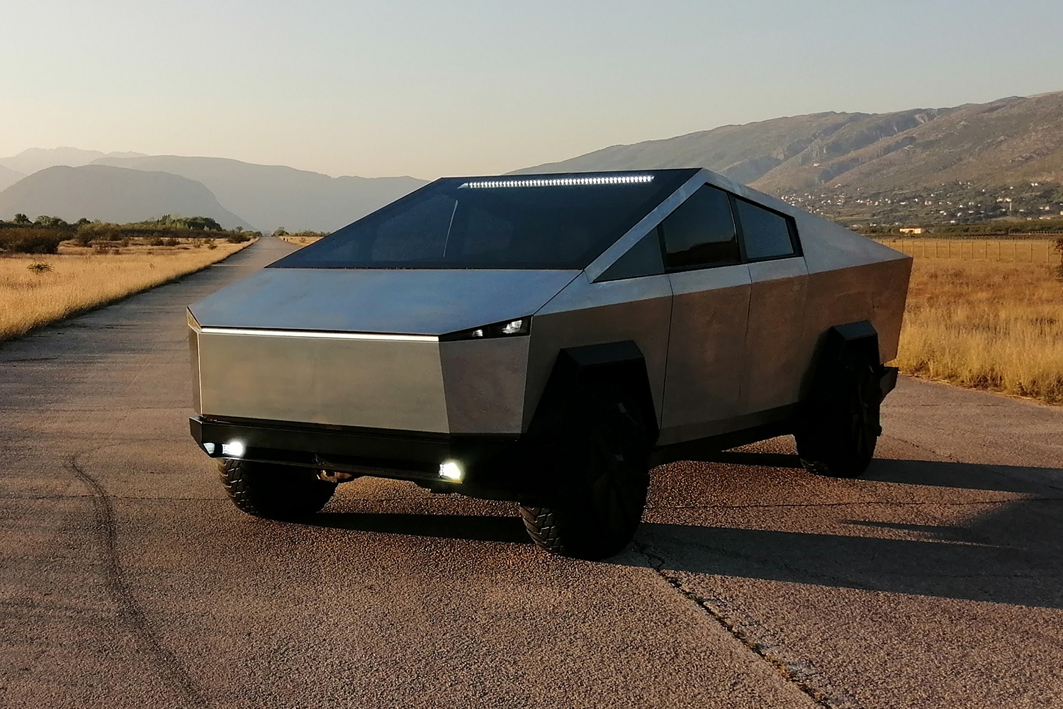 A Tesla Cybertruck replica based on a Ford F-150 Raptor that was built by the team at Stark Solutions in Bosnia and Herzegovina. We spoke with Stark employee Mario Coric about the vehicle and his boss, Igor Krezic, who commissioned it.