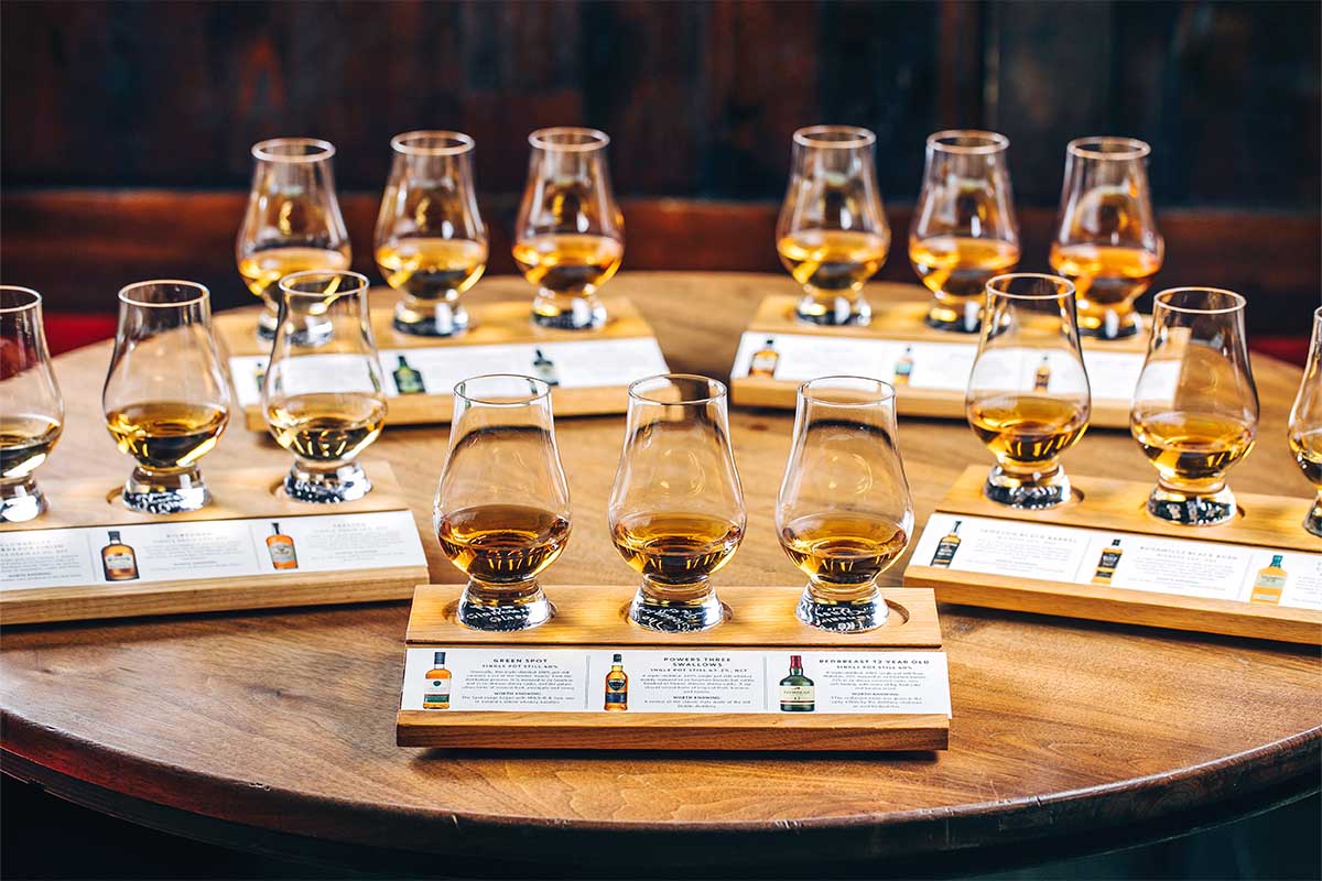 Tasting glasses on a table filled with different Irish whiskey samples. The styles of Irish whiskey are explained in "Paddy Drinks," a new book by the team behind the NYC bar The Dead Rabbit