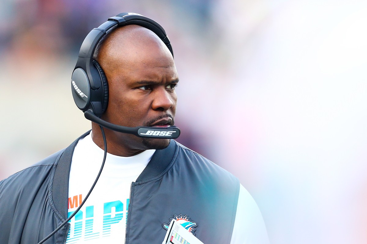 Brian Flores looks on during a game against the New England Patriots in 2019