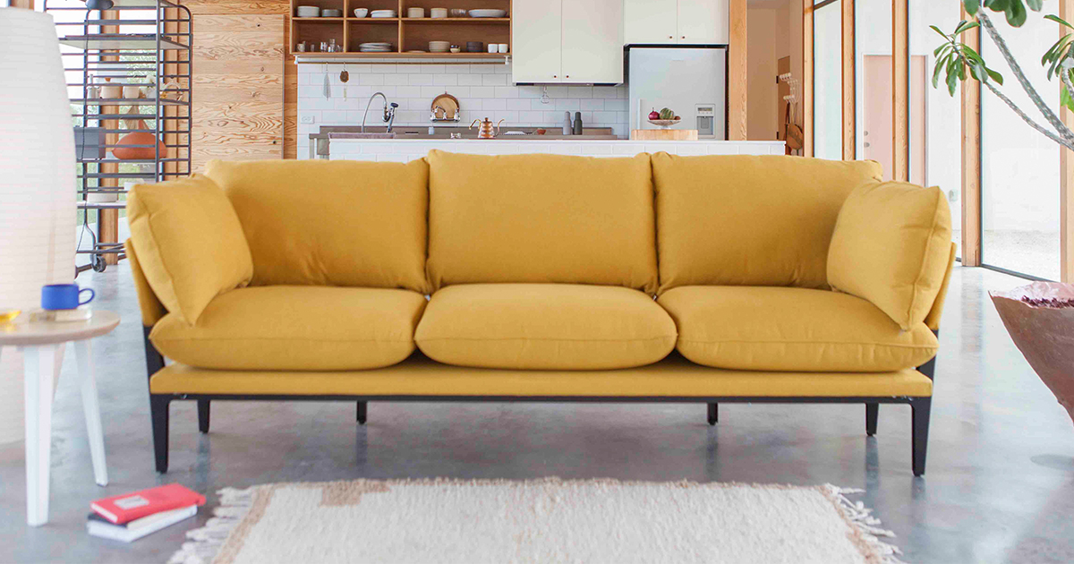 The Sofar from Floyd, a three-seat couch in saffron, which is on sale for President's Day 2022