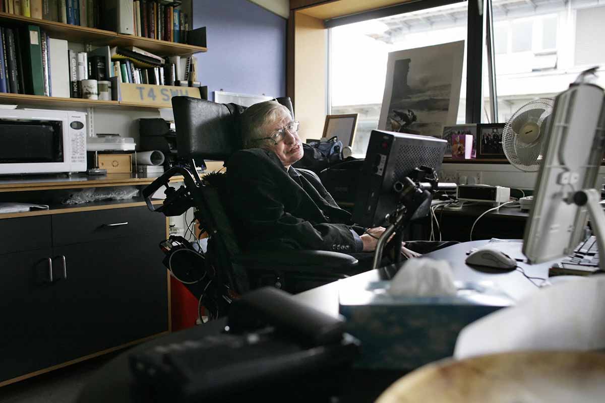 Professor Stephen Hawking, poses for photographs in his office at The Centre for Mathematical Sciences in Cambridge, in central England, 03 September 2007