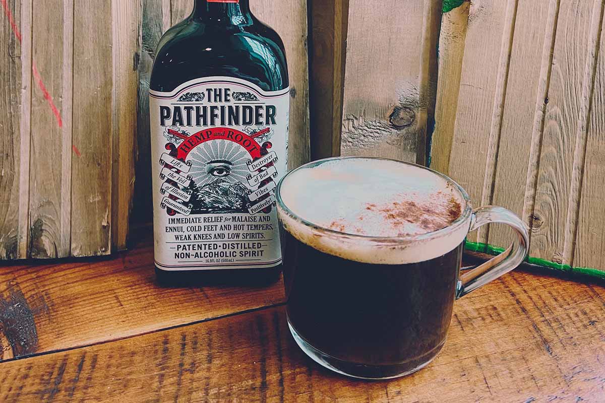the Pathfinder hemp spirit on a table with an Irish coffee