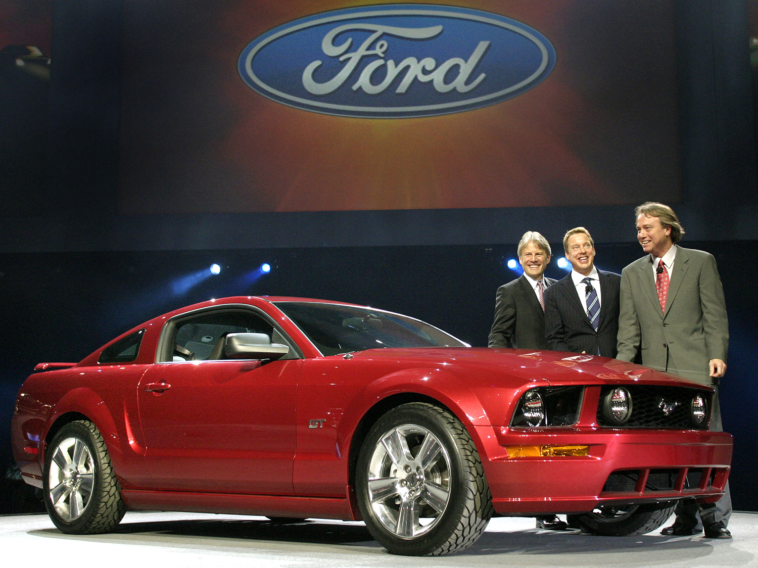 Phil Martens, Bill Ford and J Mays show off the new Ford Mustang in Detroit in 2004 at the North American International Auto Show