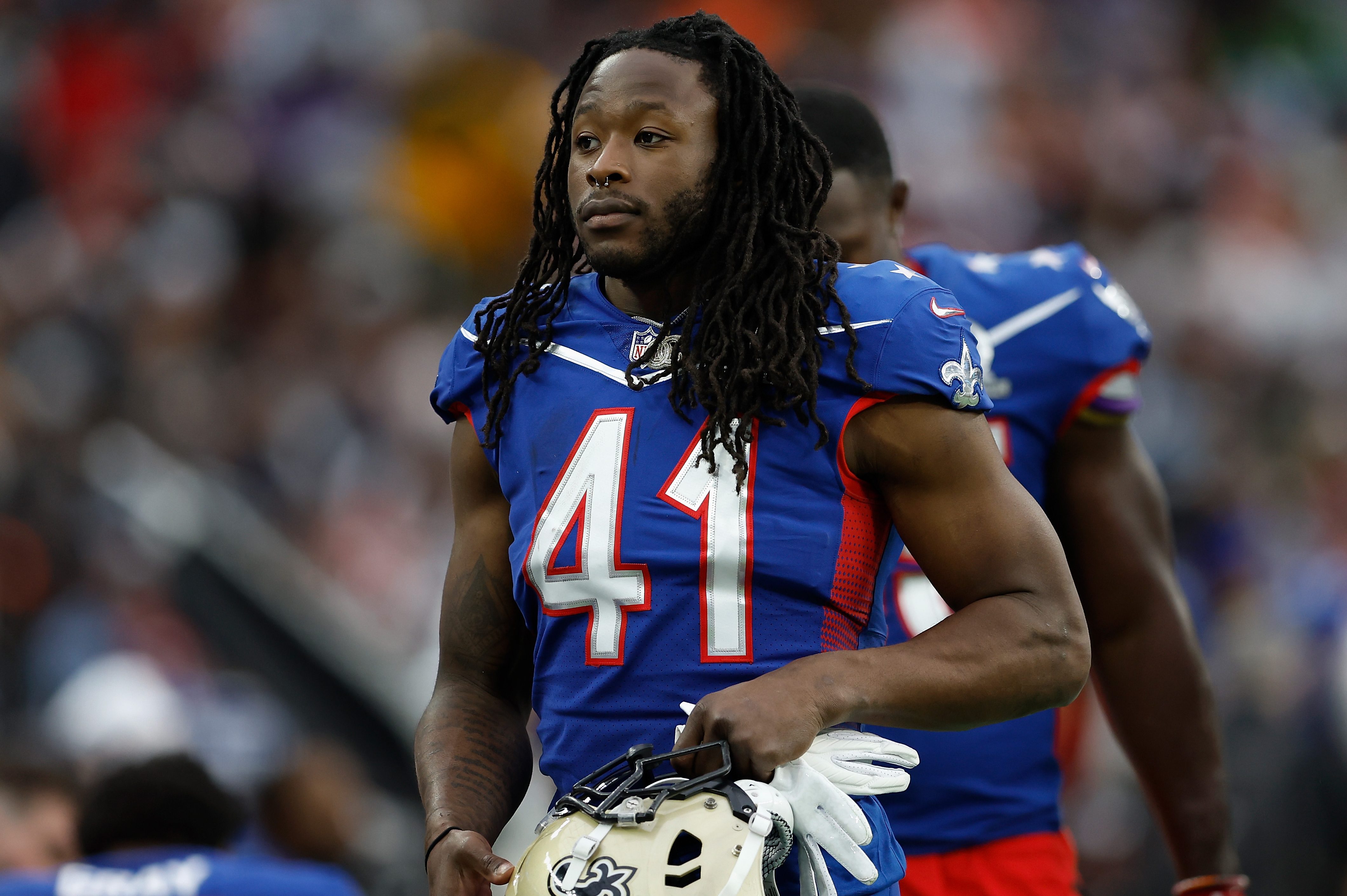 Alvin Kamara of the New Orleans Saints and NFC walks the sidelines at the Pro Bowl. After the game on Sunday, Kamara was arrested and charged with battery in connection with an incident that happened on Saturday morning.