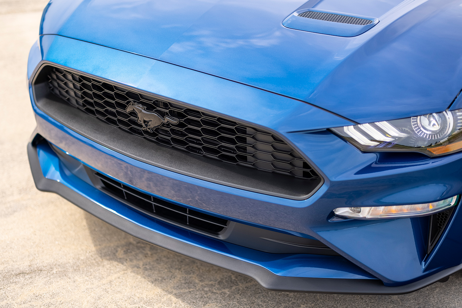 The front end of a 2022 Ford Mustang car. What will the seventh-generation S650 Mustang look like? We rounded up what we know so far.
