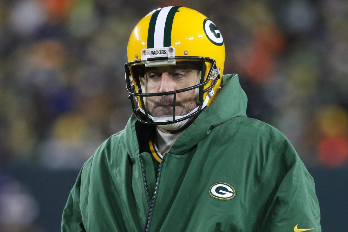 Green Bay Packers quarterback Aaron Rodgers keeps warm during a time out at Lambeau Field. The Green Bay Packers recently denied telling Rodgers they would trade him if he wanted after the 2021 season.