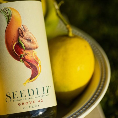 A bottle of non-alcoholic Seedlip and some lemons in a basket. Non-alcoholic drinks consumption grew during Dry January.