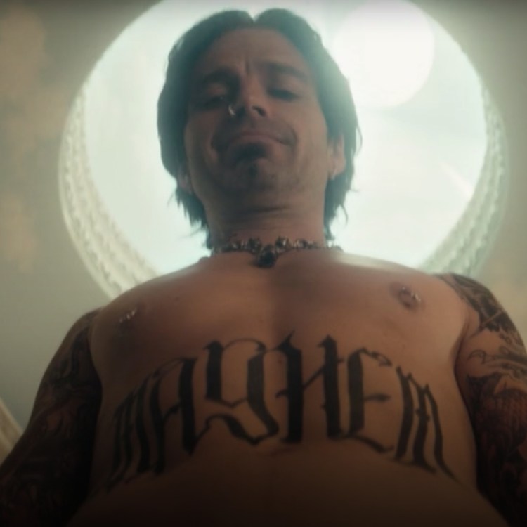 Tommy Lee (played by Sebastian Stan) gazes down upon his talking penis in this screenshot from Hulu's "Pam & Tommy"