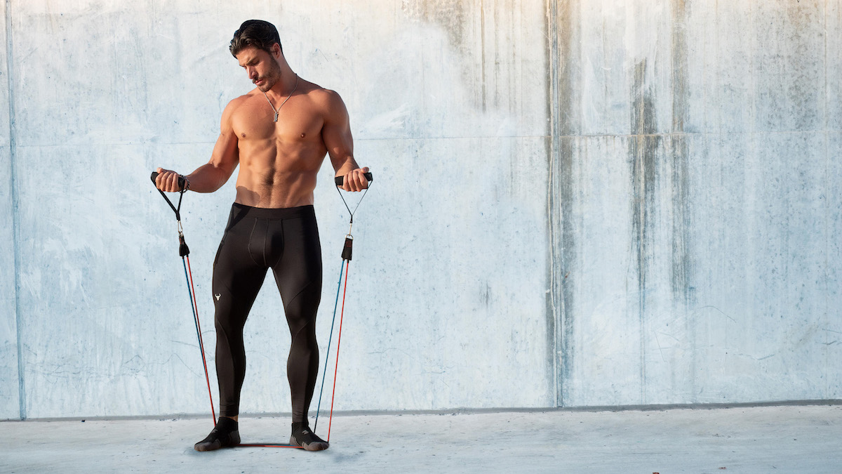 a model in Matador Meggings working out shirtless against a marble background