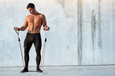 a model in Matador Meggings working out shirtless against a marble background