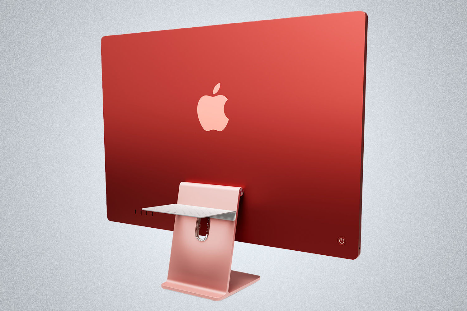 a apple iMac w/ a charging pad