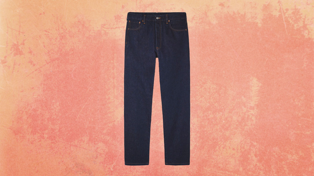 A pair of jeans on a orange background