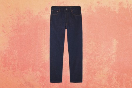 A pair of jeans on a orange background