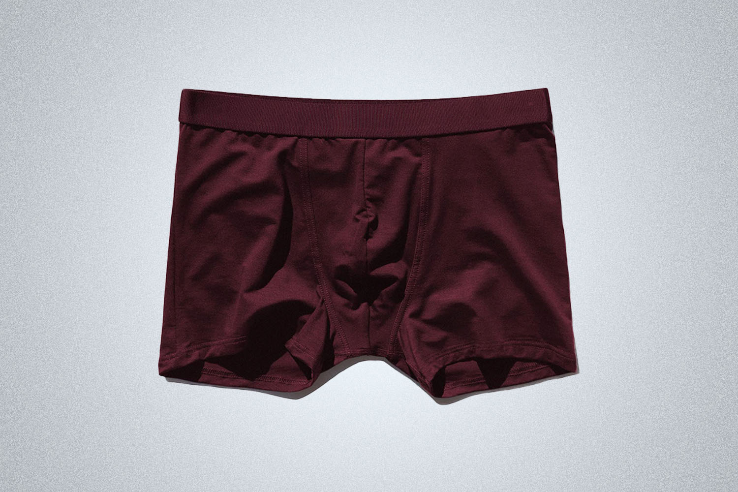 a pair of red boxers on a grey background