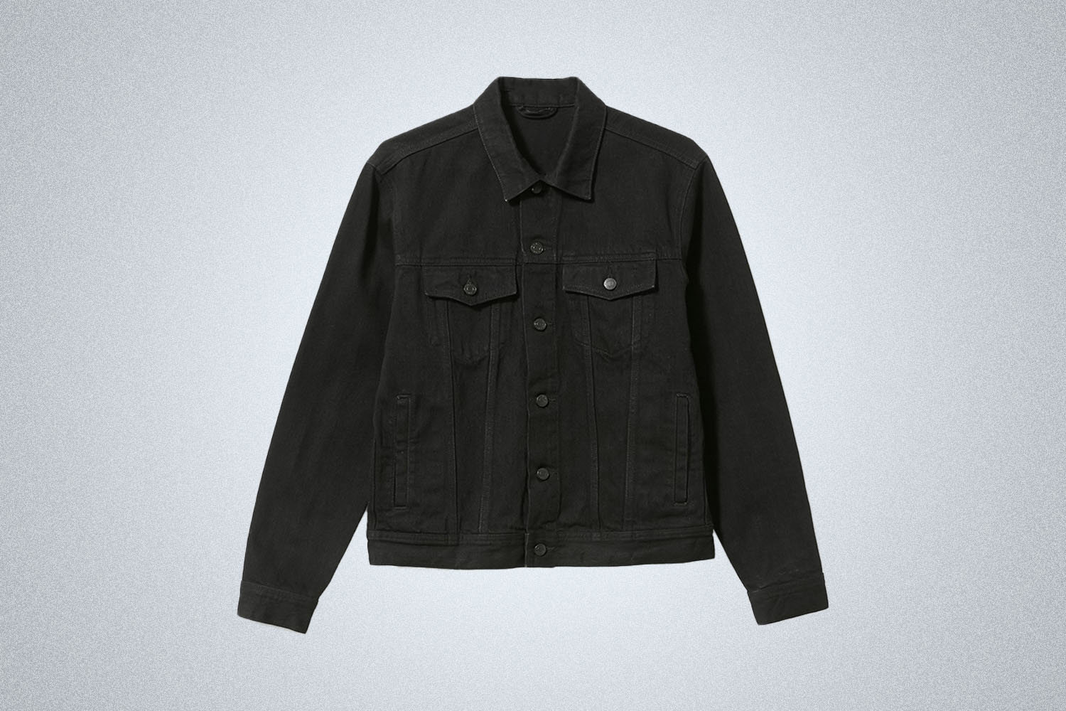 An Everlane Denim Jacket on a grey background