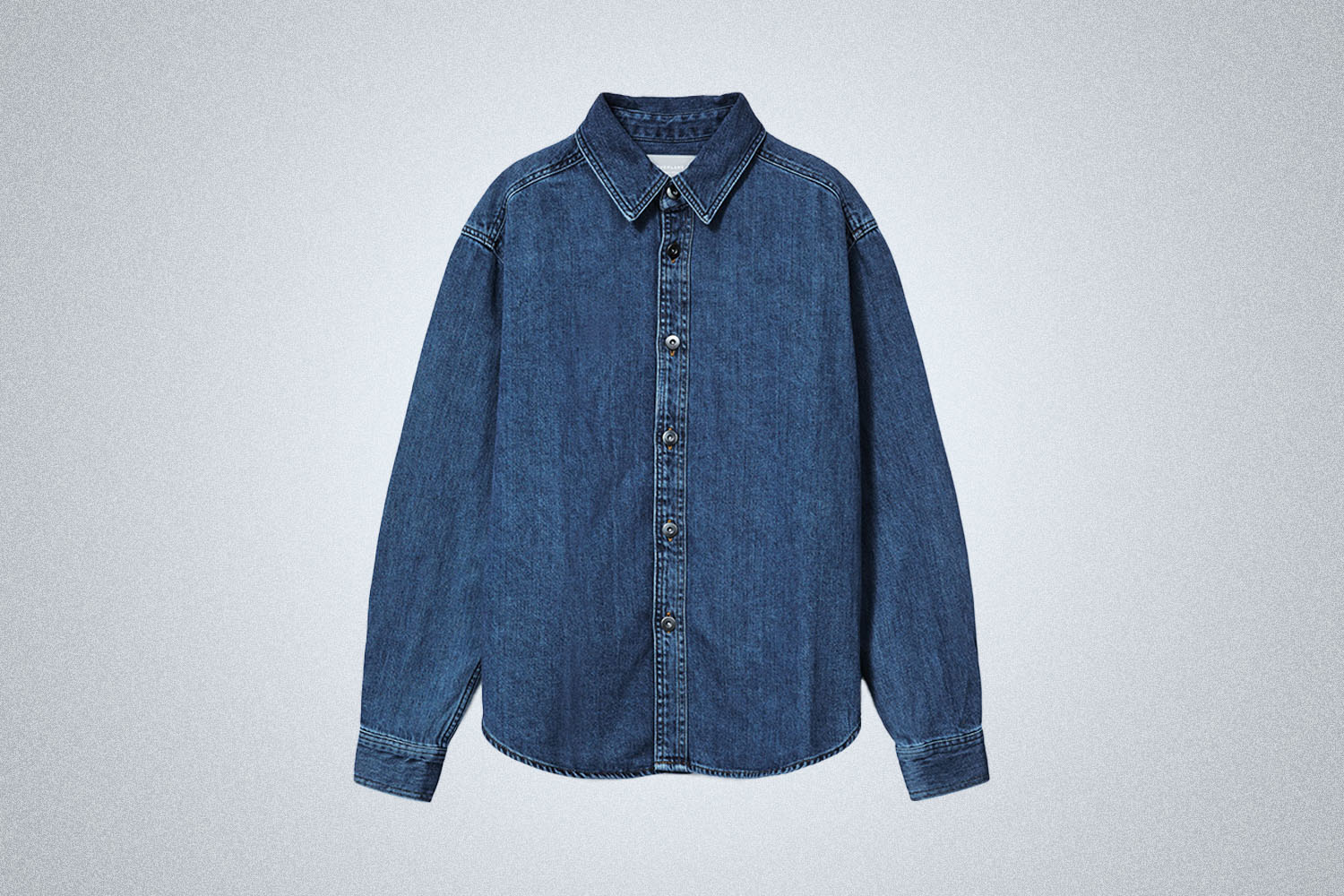An Everlane Denim Overshirt on a grey background