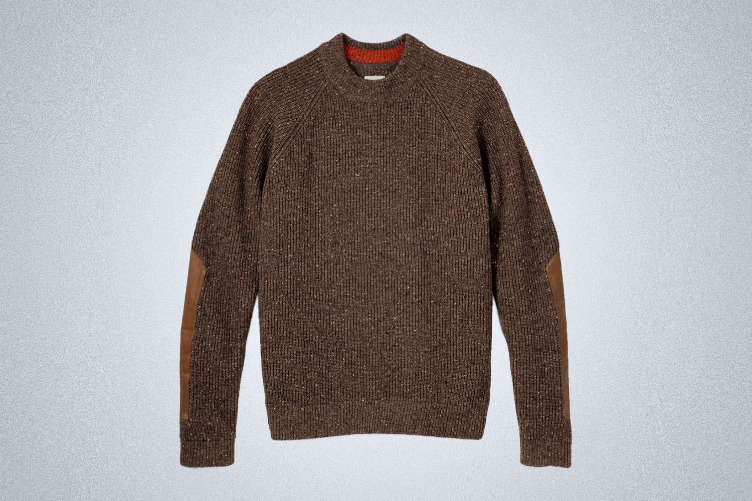 a brown sweater on a grey background