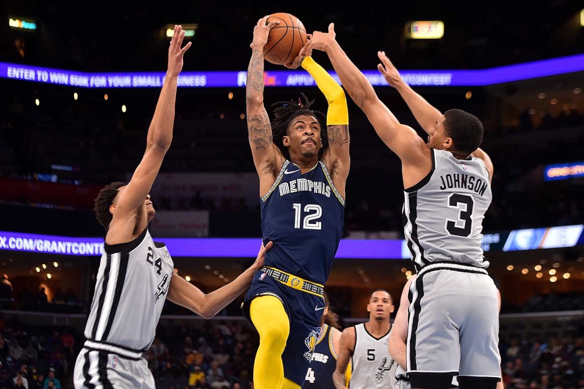 : Ja Morant #12 of the Memphis Grizzlies goes to the basket during the game against the San Antonio Spurs at FedExForum on February 28, 2022 in Memphis, Tennessee.