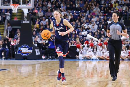 UConn Huskies guard Paige Bueckers with the ball during the Elite Eight of the Women's Div I NCAA Basketball Championship.