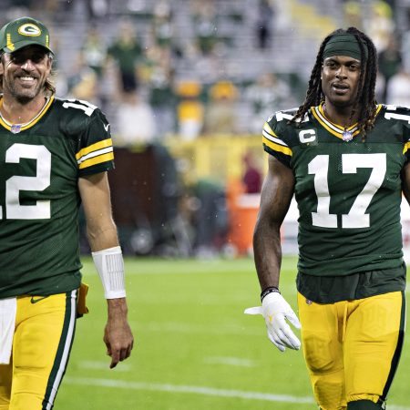 Aaron Rodgers and Davante Adams of the Green Bay Packers walk off the field together
