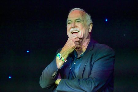 John Cleese speaks onstage at "Comedy with the Cleeses" during the 2022 SXSW Conference. At another panel, Cleese had his microphone taken away by Dulce Sloan after going on a rant about slavery.
