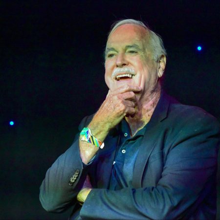 John Cleese speaks onstage at "Comedy with the Cleeses" during the 2022 SXSW Conference. At another panel, Cleese had his microphone taken away by Dulce Sloan after going on a rant about slavery.