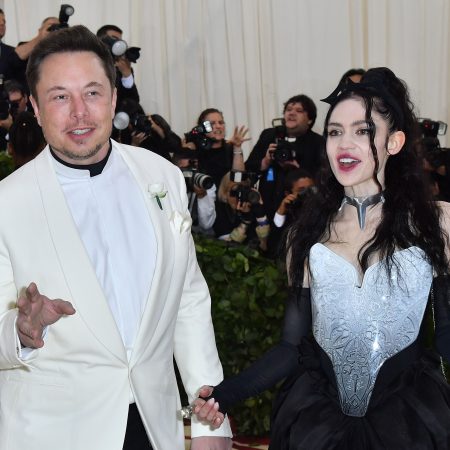 Elon Musk and Grimes arrive for the 2018 Met Gala on May 7, 2018, at the Metropolitan Museum of Art in New York. The singer claims Musk "lives below the poverty line"