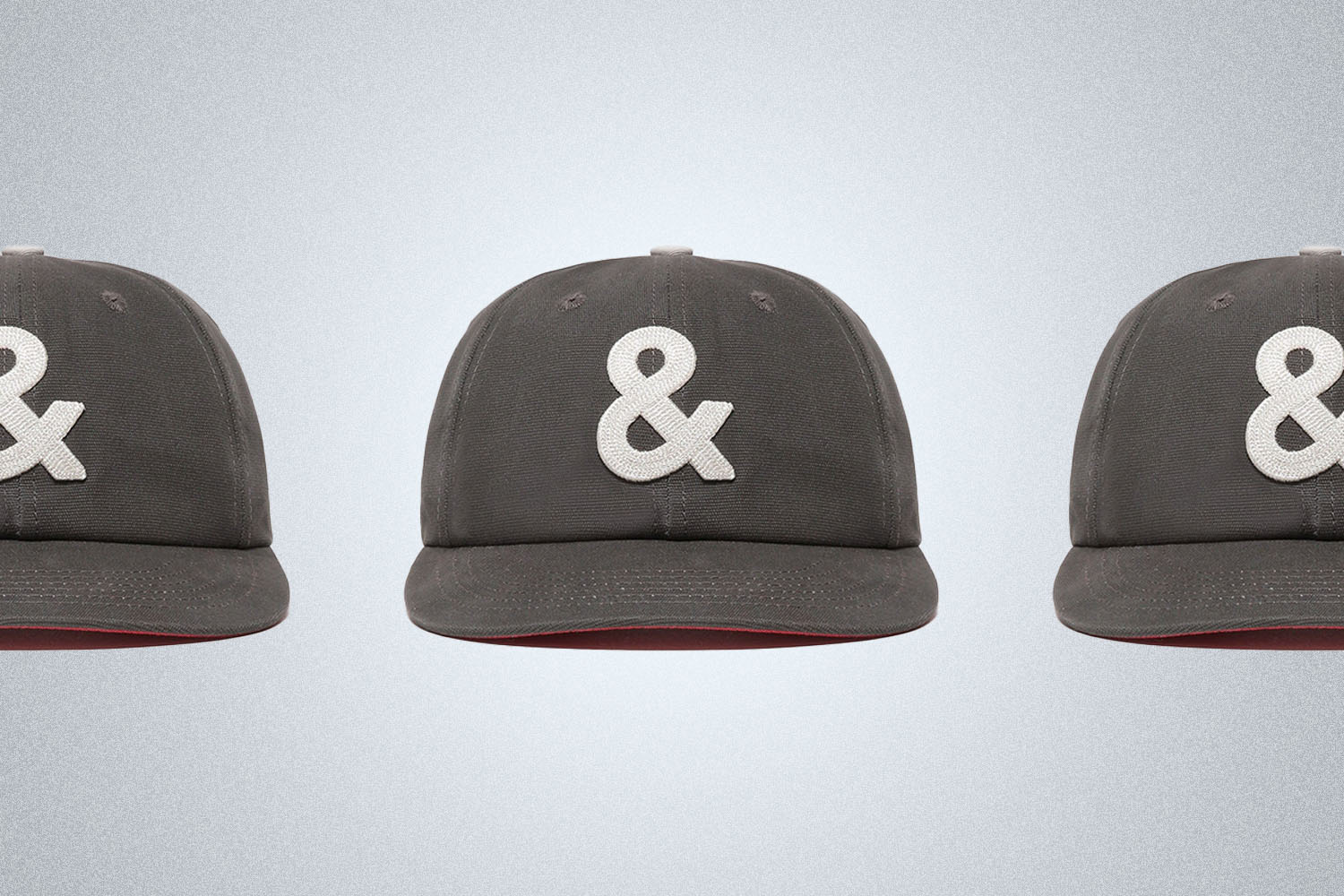 a Hat with an ampersand on a grey background 
