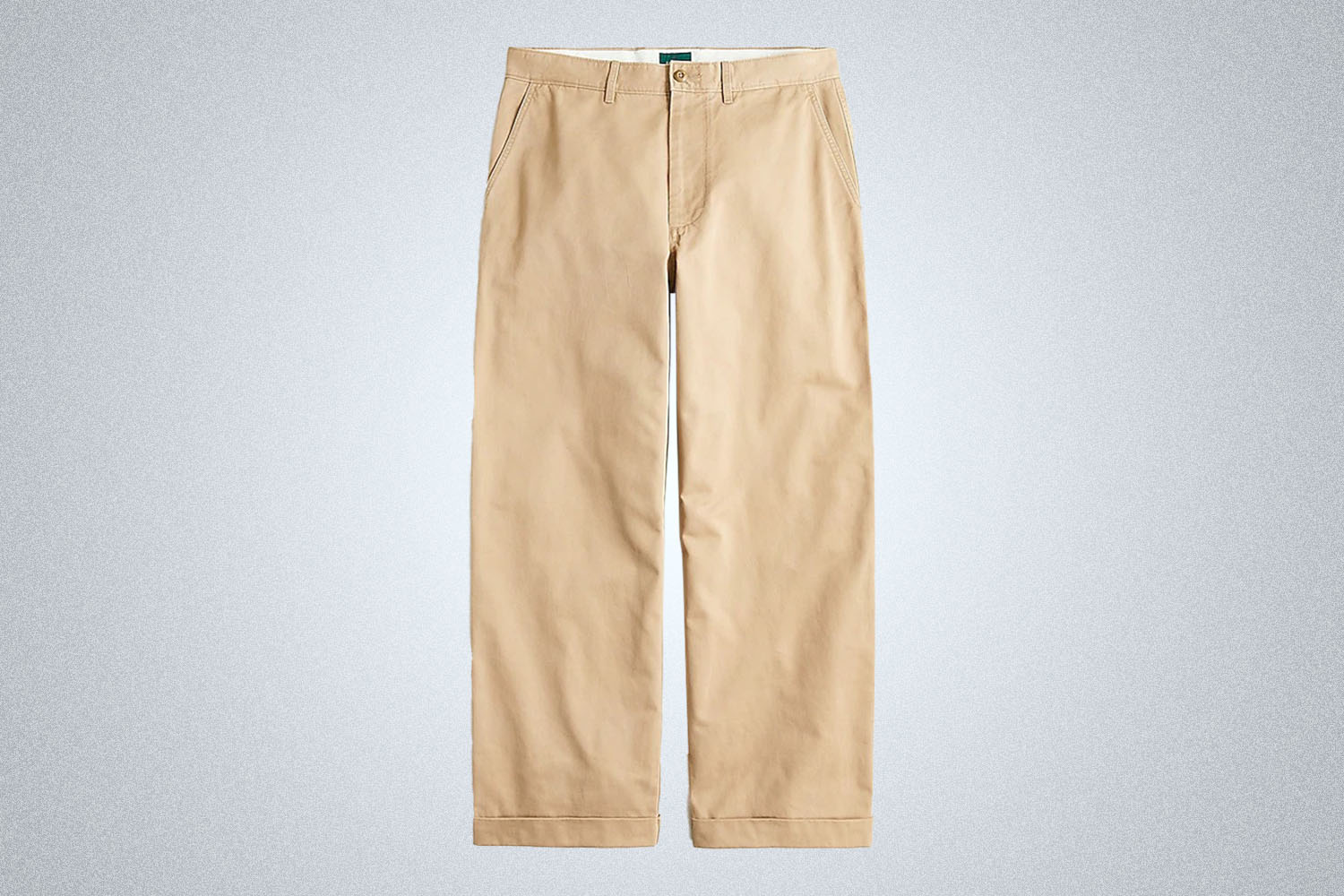 a pair of tan J.Crew chinos on a grey background