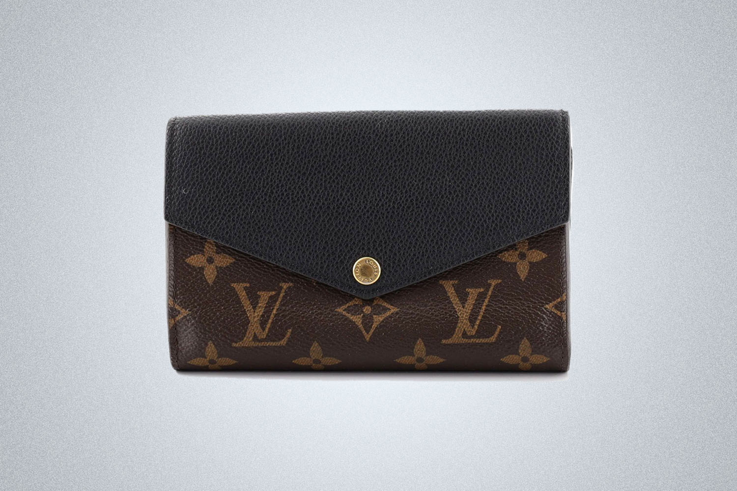a LV wallet on a grey background