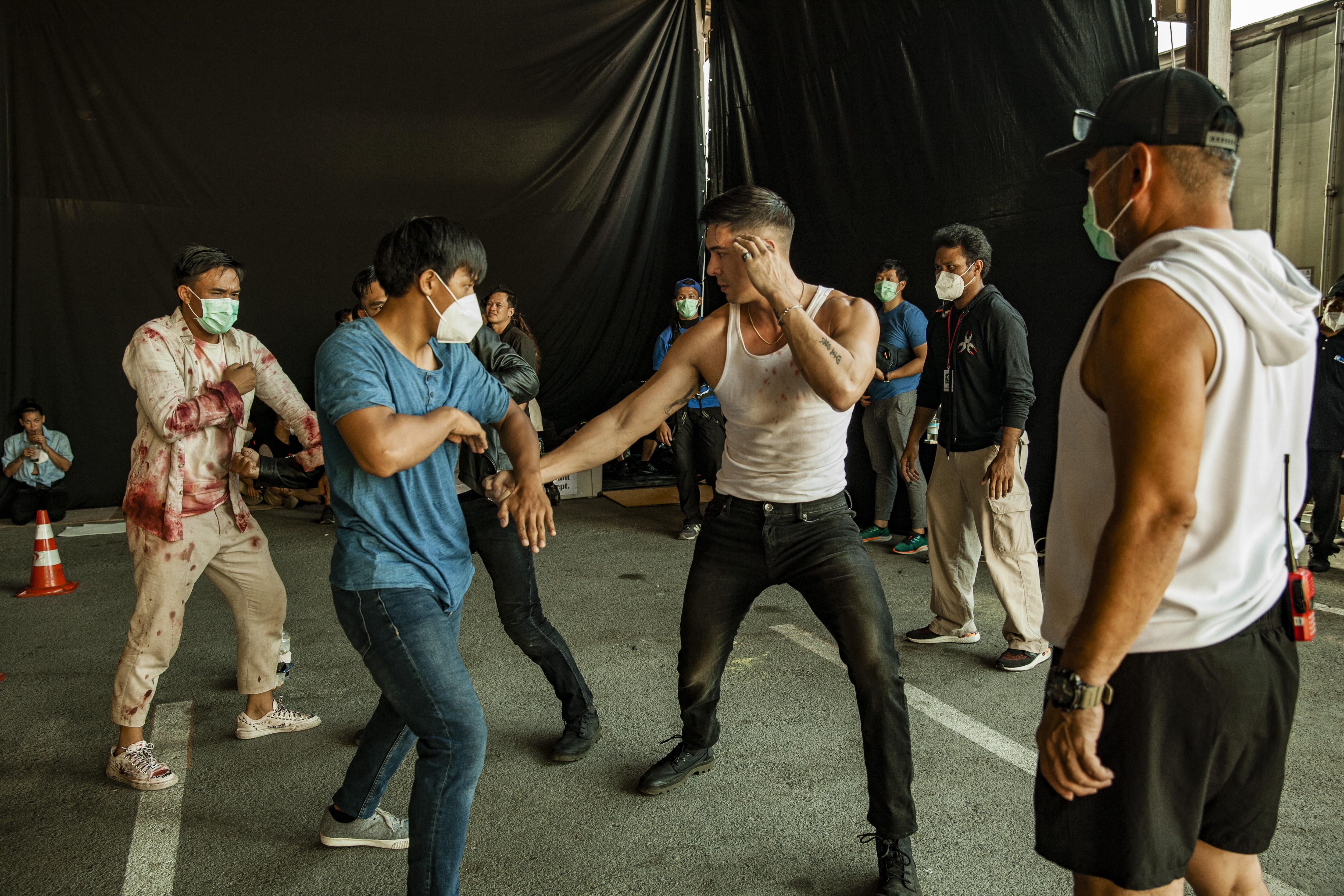 Lewis Tan helps coordinate a stunt on the set of Fistful of Vengeance