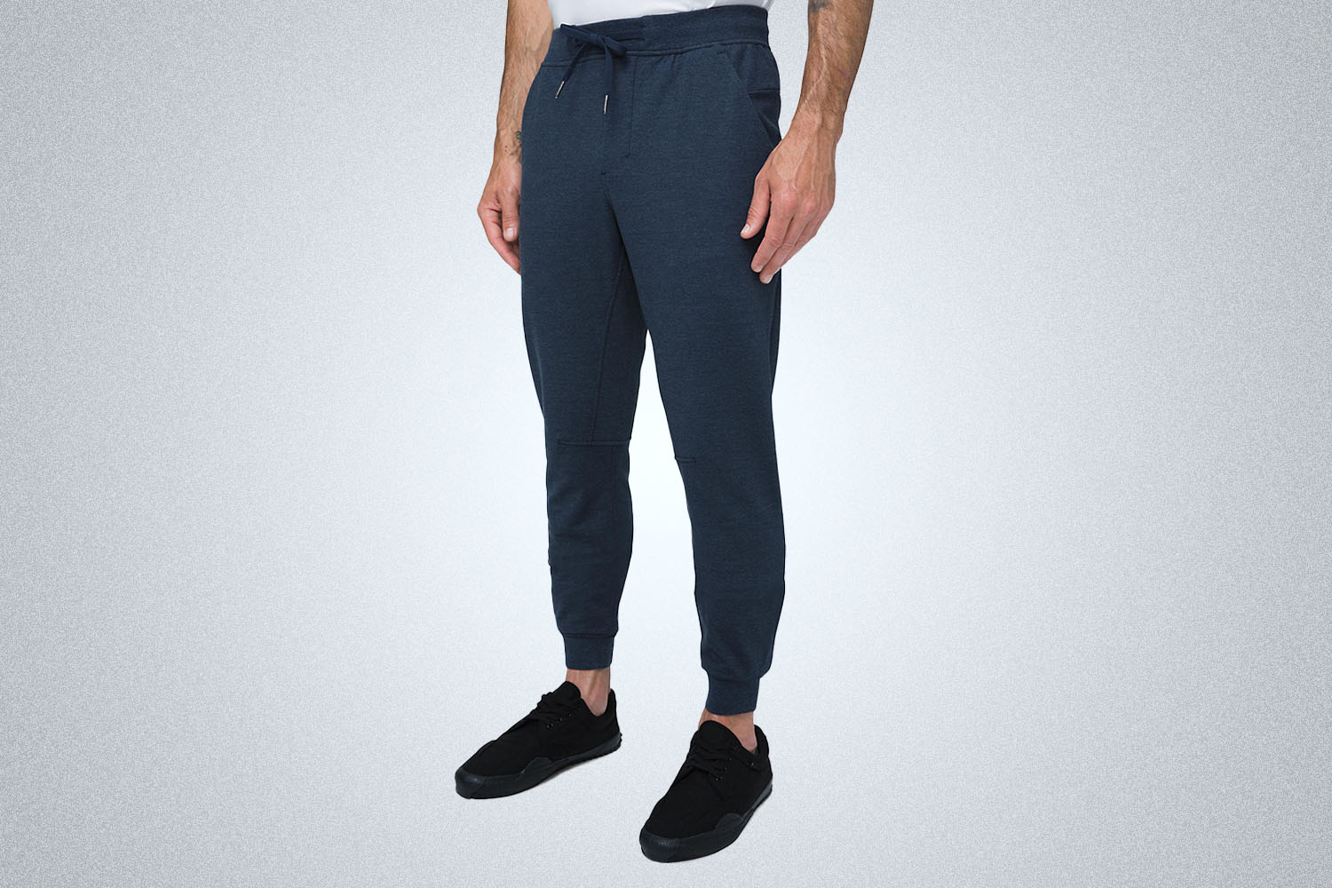a pair of blue joggers on a model
