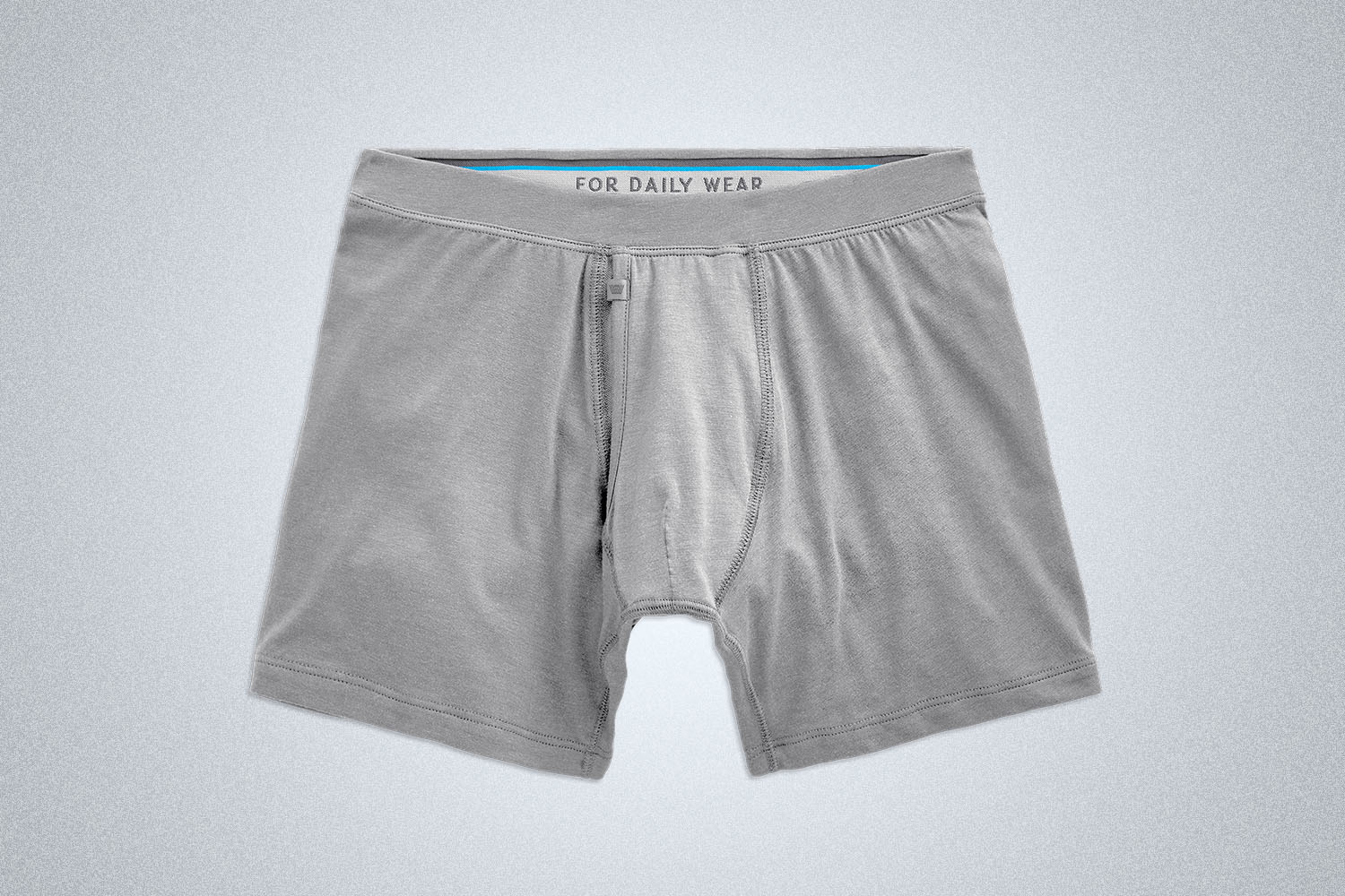 a pair of grey trunks on a grey background