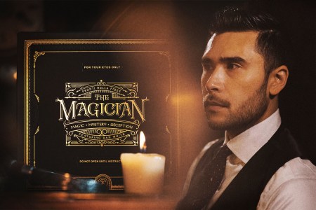Magician Dan White in a white shirt, tie and vest next to a black and gold box for his online show "The Magician," which you can buy tickets for and watch on Zoom.