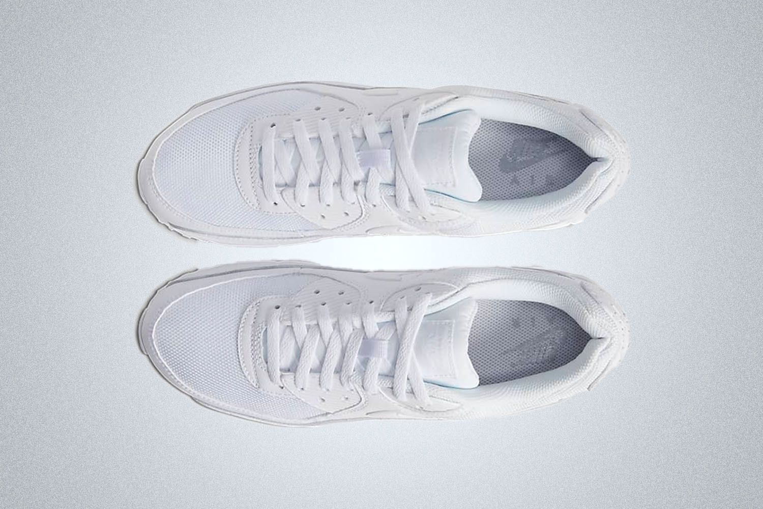 a white shoe on a light grey background