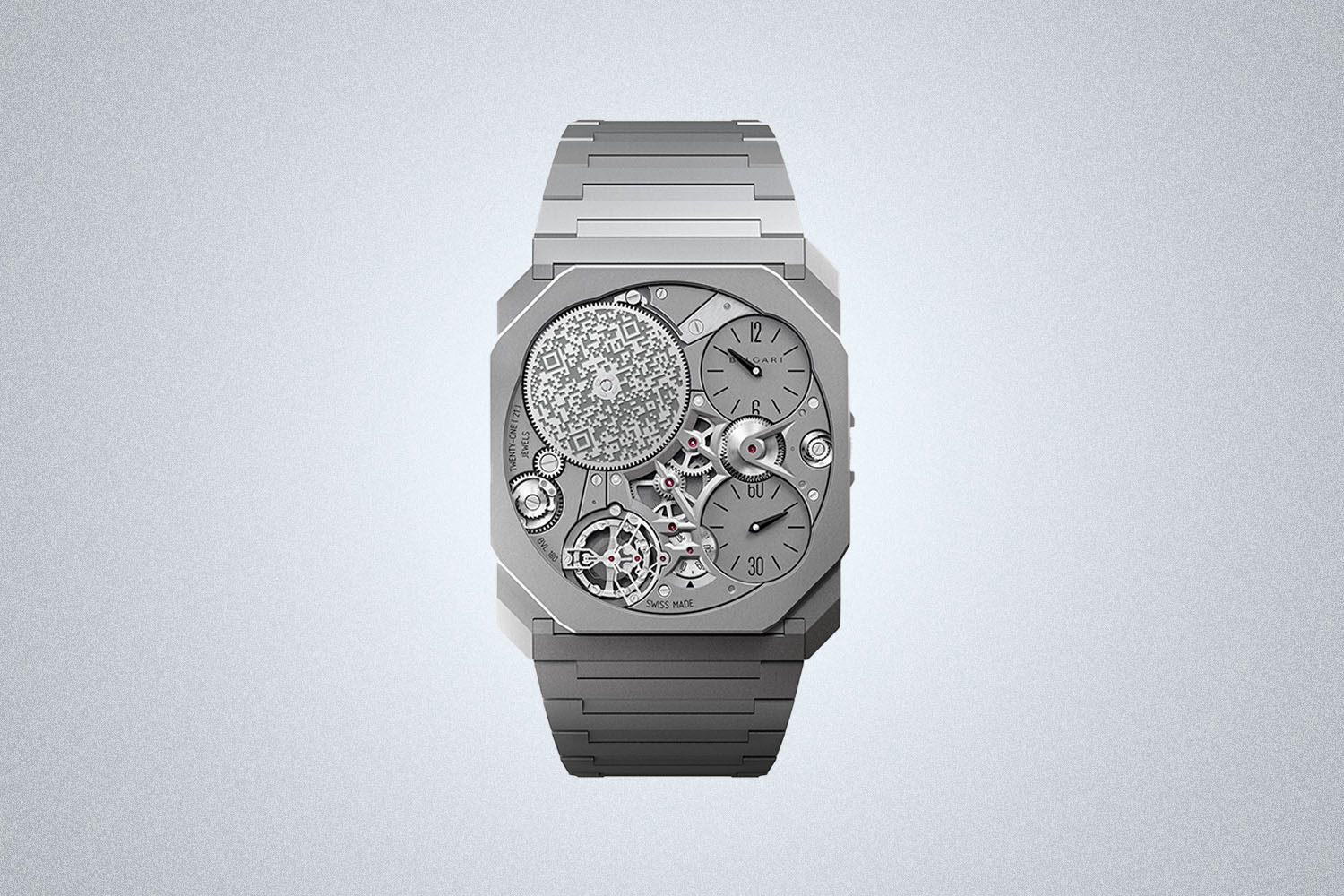a steel watch on a grey background