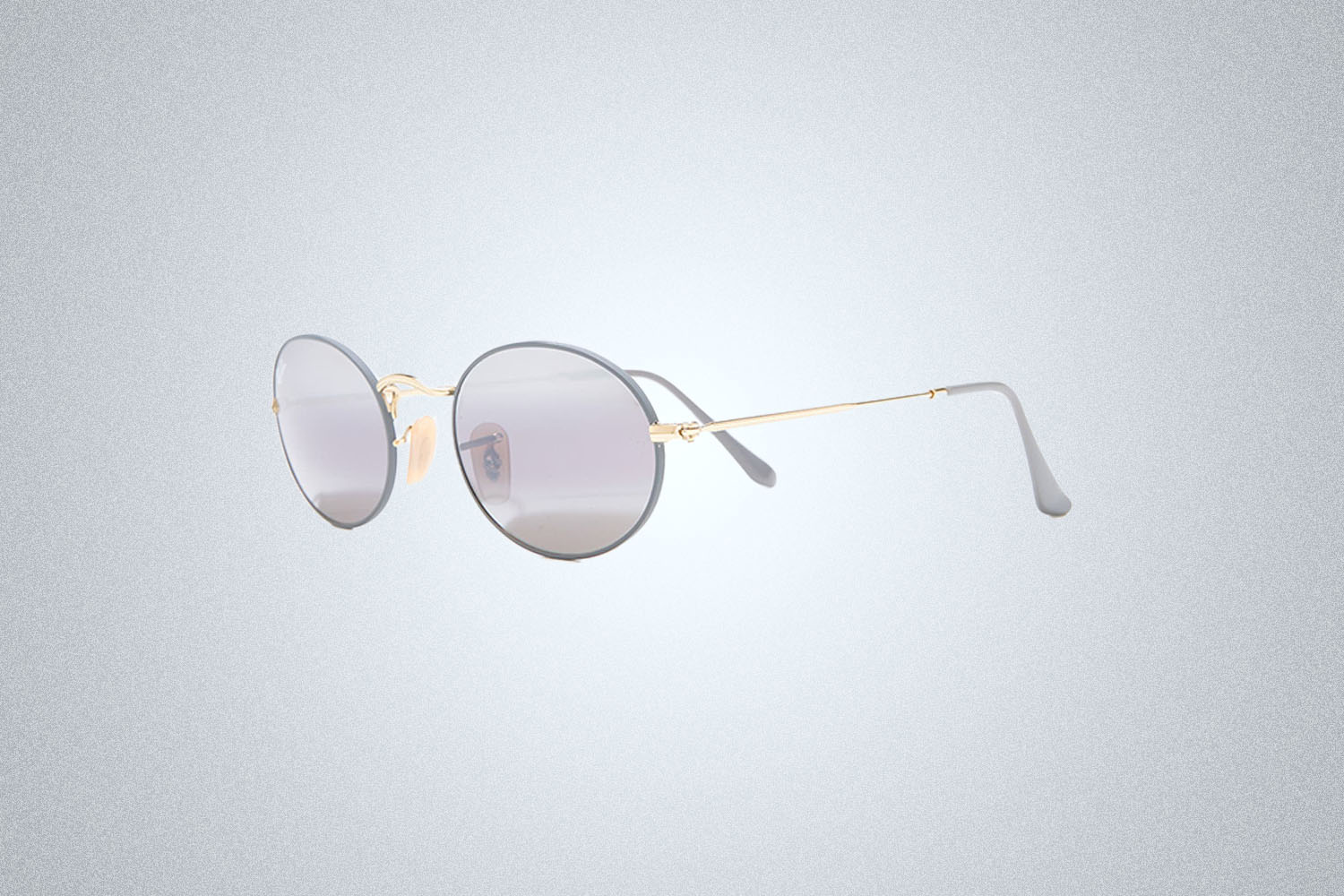 A pair of sunglasses on a grey background