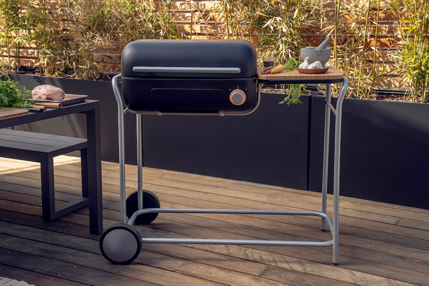 A charcoal spark grill on a deck