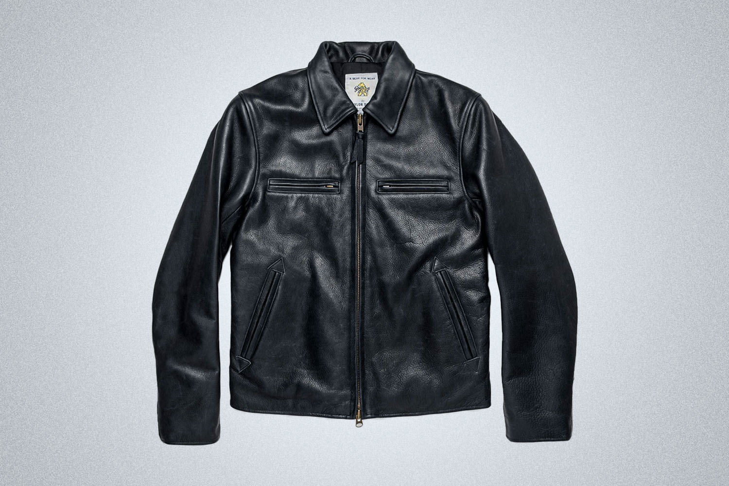 a black leather jacket on a grey background