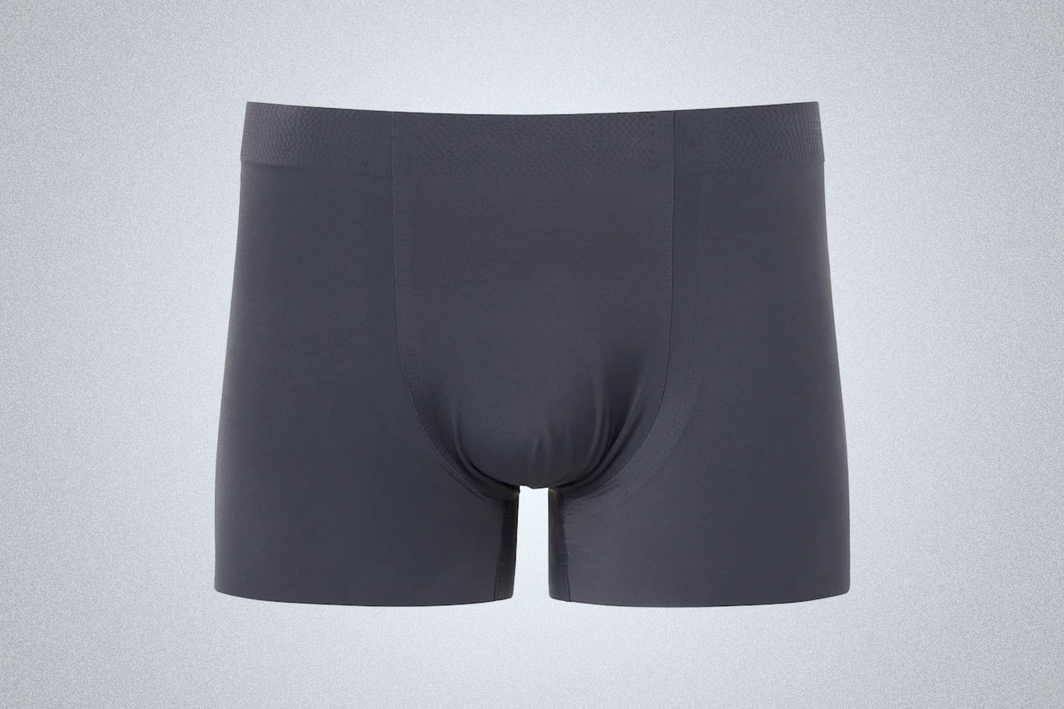 a pair of dark grey seamless Uniqlo Airism Briefs on a gray background