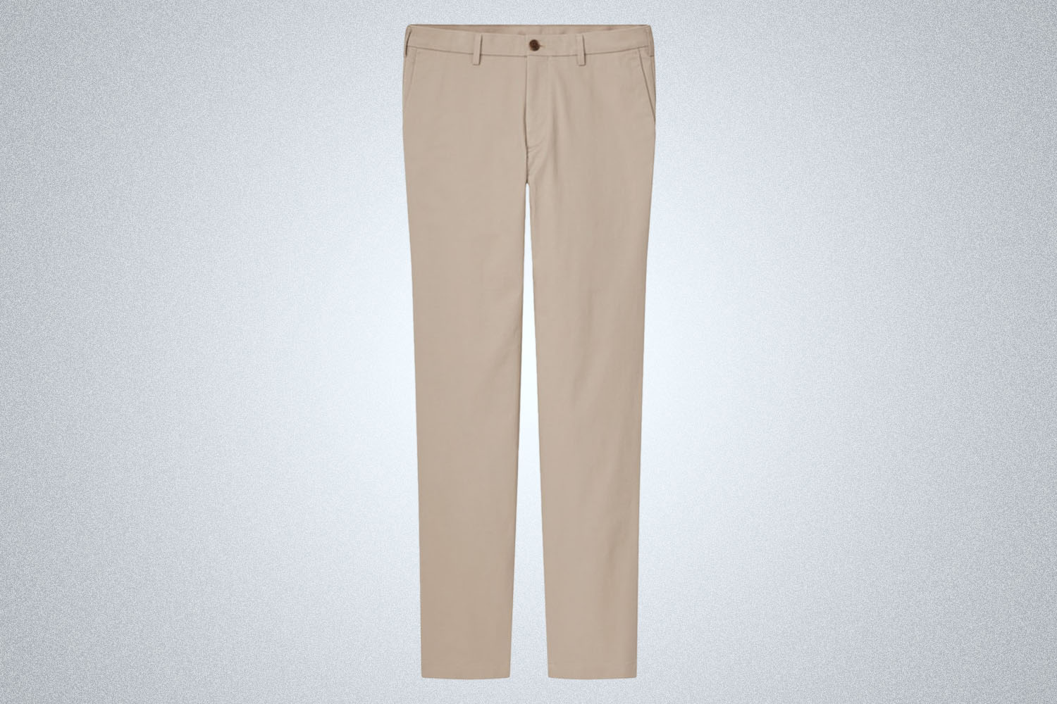 a pair of tan Uniqlo chinos on a grey background 