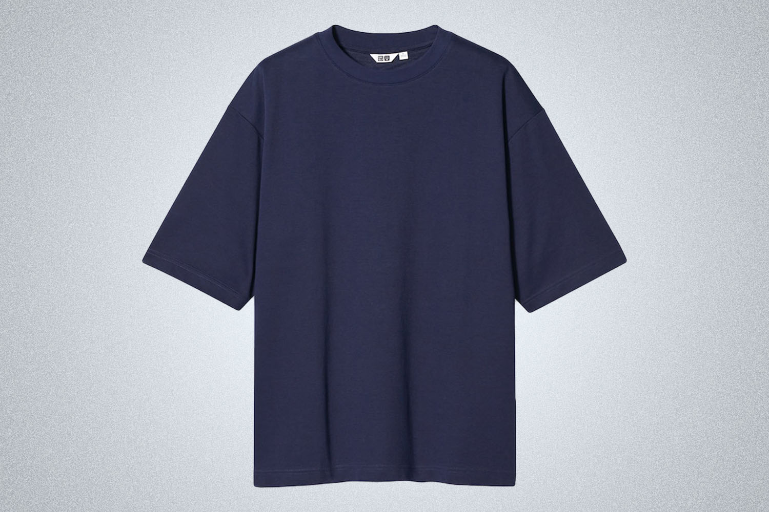 a blue tee on a grey background