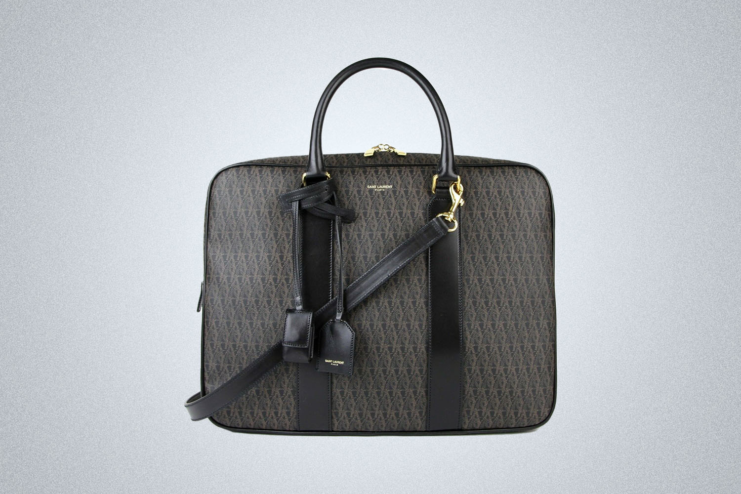 a YSL briefcase on a grey background