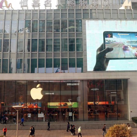 Customers shop at apple's flagship store for smart products on Nanjing Road pedestrian street in Shanghai, China