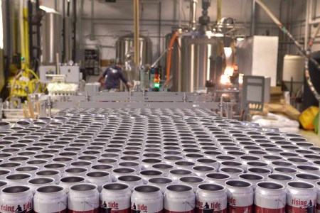A booming microbrewery industry has led to a shortage of the humble beer can. That's left Maine brewers scrambling to plan for the busy summer season. Beer cans wait for the conveyor belt during a canning run at Portland's Rising Tide Brewery on Monday afternoon (photo from 2014; a can shortage has come up again now in 2022)