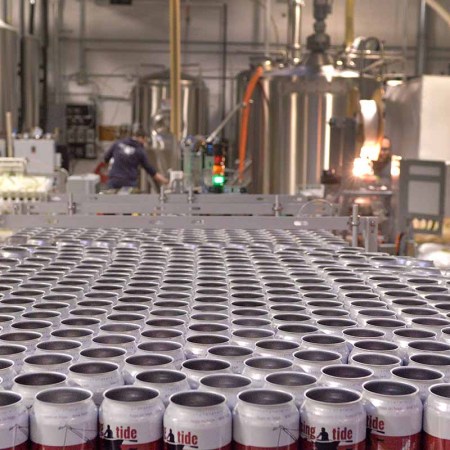 A booming microbrewery industry has led to a shortage of the humble beer can. That's left Maine brewers scrambling to plan for the busy summer season. Beer cans wait for the conveyor belt during a canning run at Portland's Rising Tide Brewery on Monday afternoon (photo from 2014; a can shortage has come up again now in 2022)