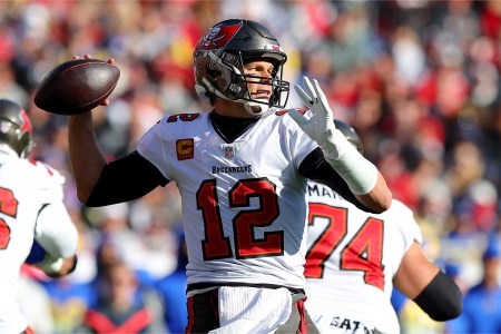 Tom Brady #12 of the Tampa Bay Buccaneers throws a pass in the second quarter of the game against the Los Angeles Rams in the NFC Divisional Playoff game at Raymond James Stadium on January 23, 2022 in Tampa, Florida.