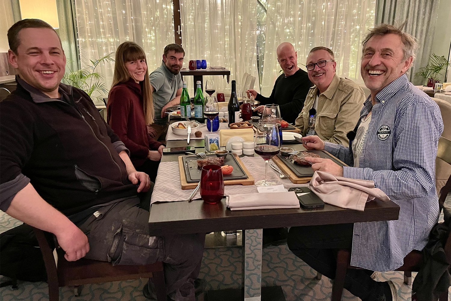 The DefenderX group, including Sofie Rørdam, Misha Vikhrov, Mikael Strandberg, Jeff Willner, and Steve Brooks, sitting down to dinner in Russia