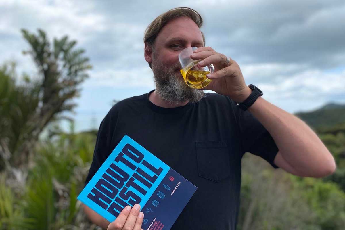 Aaron Hyde, author of "How to Distill," taking a sip of a drink