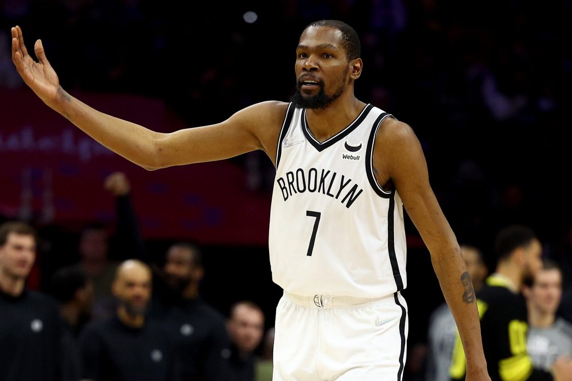 Kevin Durant of the Brooklyn Nets encourages the crowd to keep booing. The star player recently criticized NYC Mayor Eric Adams for the city policy that doesn't allow unvaxxed teammate Kyrie Irving to play home games.
